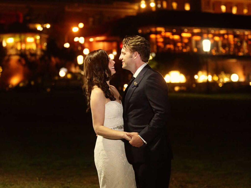 Bride And Groom In Front Of Ghirardelli Sign.