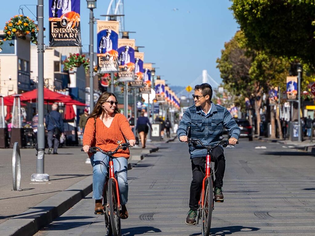 Couple Riding Bikes In San Francisco