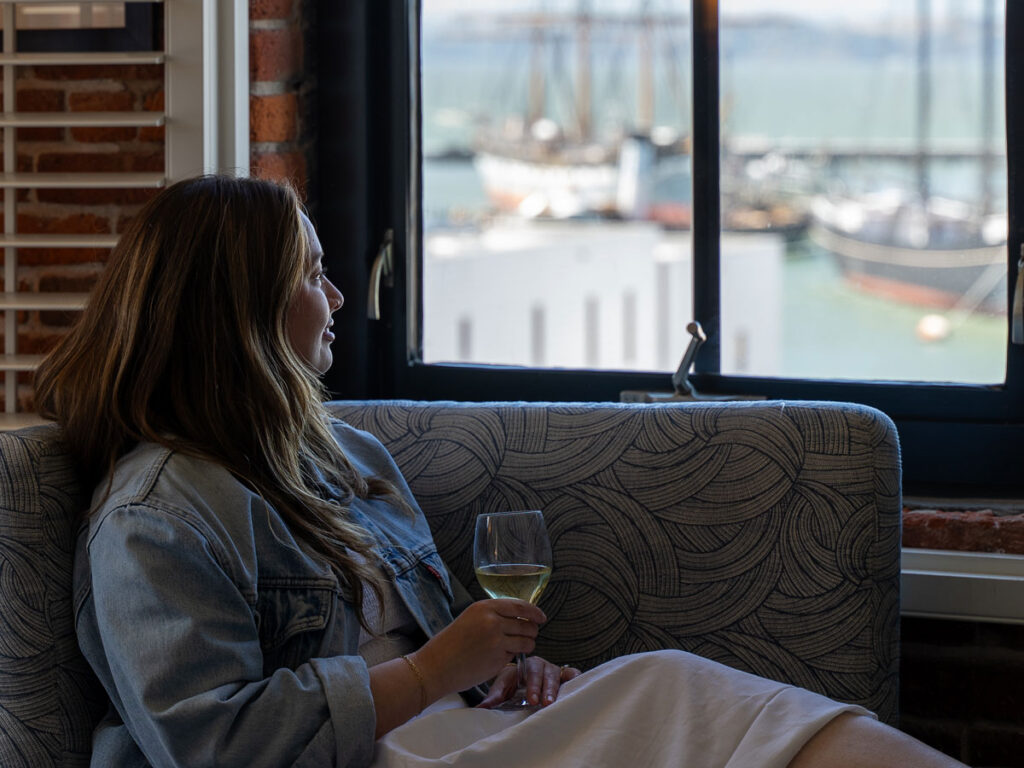 Lady With Wine Looking Out The Window